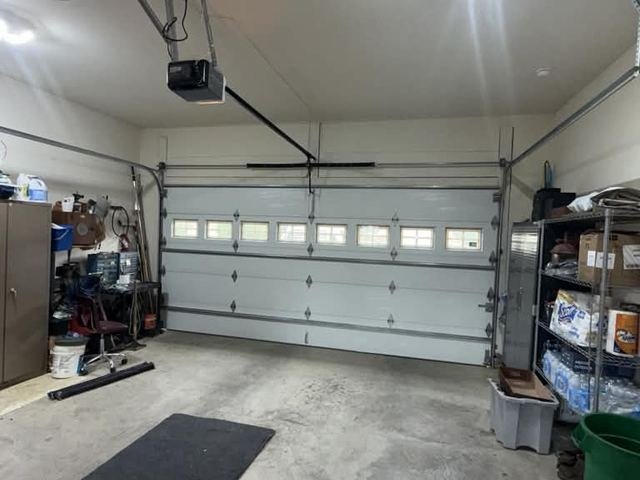 Garage door opener installed on a double door